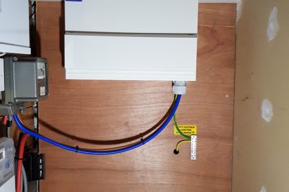 House A, Image 4. The final installation. This is what the customer sees when they open the cupboard door. Note one tidy new board with all electric cables neatly hidden in the trunking. Great improvement. 