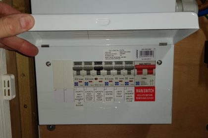 House B, Image 3. New Fuse Board Installed. Cover open to show the neatly labelled switches. 