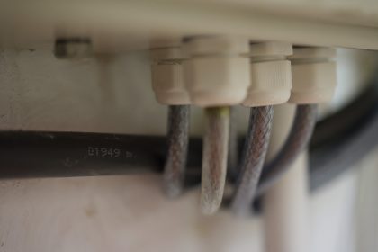 Cable entry to electrical distribution board at Macknade Fine Foods, Faversham 