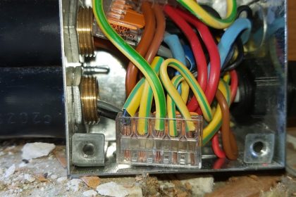 Close up image of wiring inside a junction box, Supplied by steel armoured cable, Rewire, Faversha Ketn 